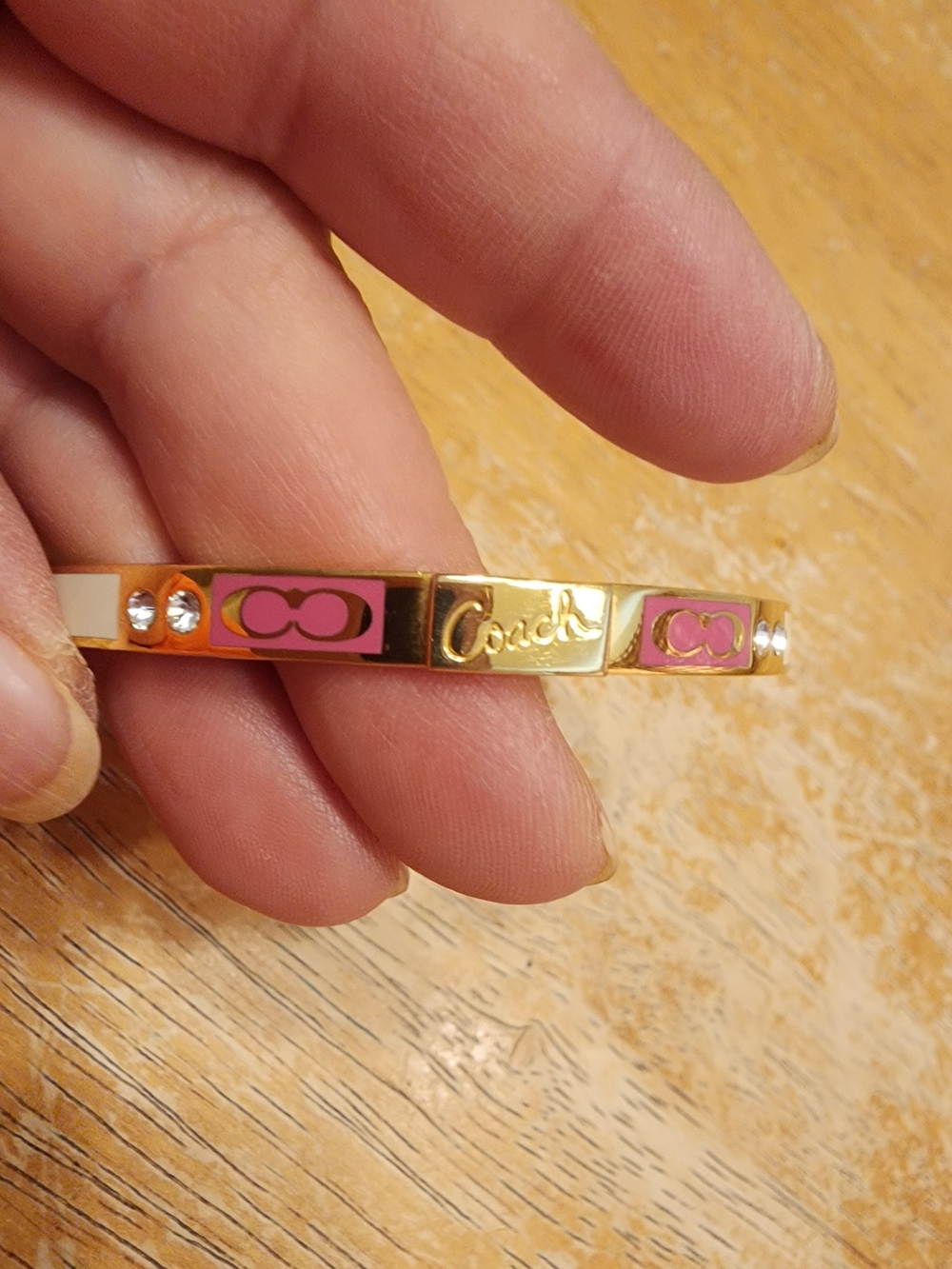 Coach Gold-Tone Bracelet with Pink Enamel Accents